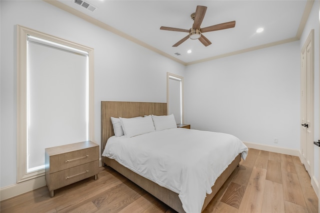 bedroom with ceiling fan and light wood-type flooring