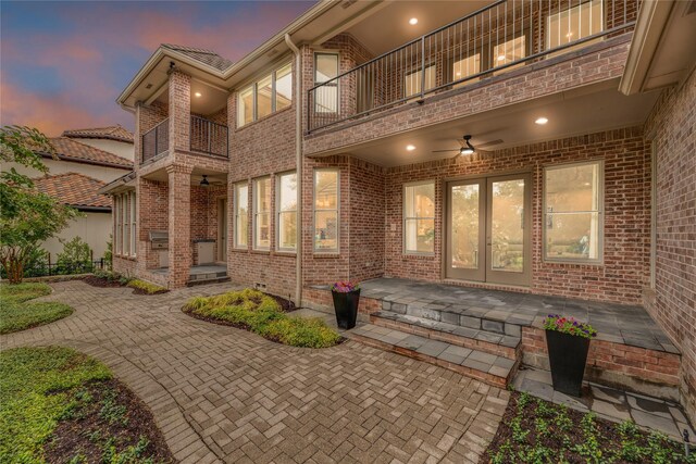 patio terrace at dusk with a balcony