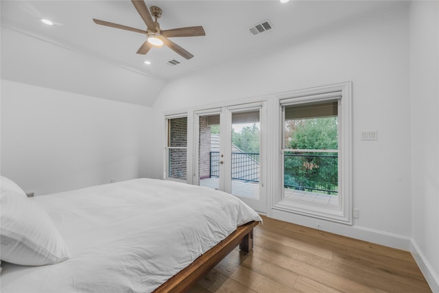 bedroom with vaulted ceiling, access to exterior, ceiling fan, light hardwood / wood-style flooring, and french doors