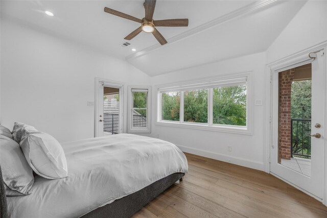 bedroom featuring ceiling fan, vaulted ceiling, light hardwood / wood-style floors, and access to exterior