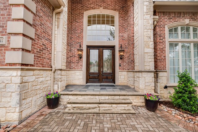 entrance to property featuring french doors