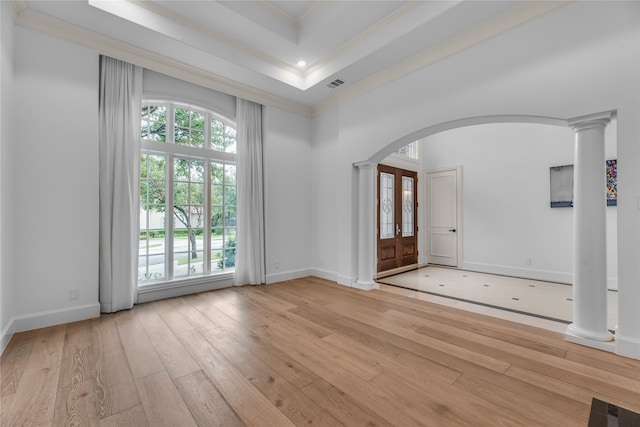 entryway featuring light hardwood / wood-style flooring, ornate columns, french doors, and crown molding