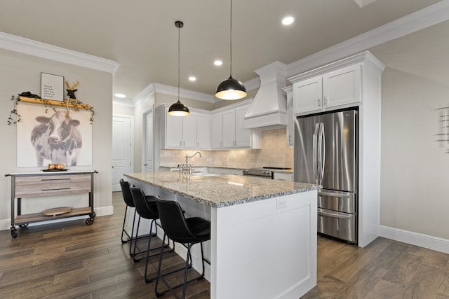 kitchen featuring white cabinets, dark wood-type flooring, custom exhaust hood, and appliances with stainless steel finishes