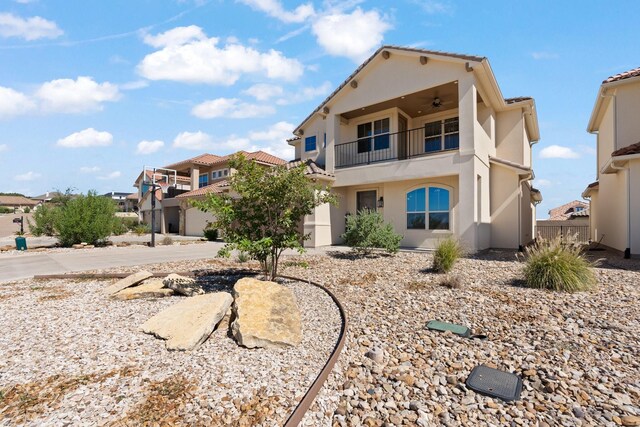 135 Valley Vw, Glen Rose, TX 76043 - back of property with a balcony, ceiling fan, stucco siding, and a residential view