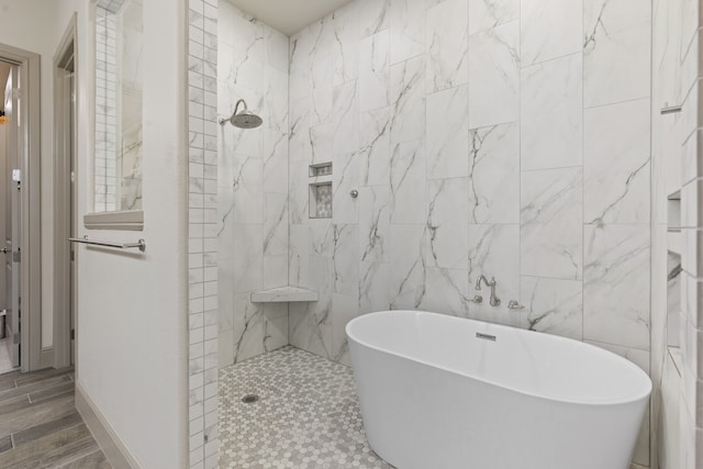 bathroom featuring tile walls, wood-type flooring, and independent shower and bath