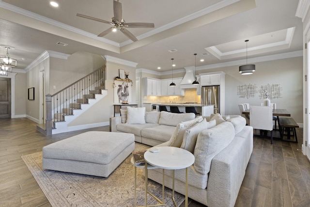 135 Valley Vw, Glen Rose, TX 76043 - living area with a raised ceiling, stairs, baseboards, ornamental molding, and a ceiling fan