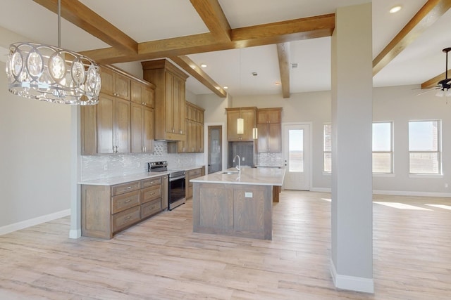 kitchen with beamed ceiling, a center island with sink, light hardwood / wood-style floors, and electric stove