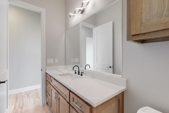 bathroom with wood-type flooring and vanity