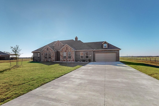 view of front facade featuring a garage and a front lawn