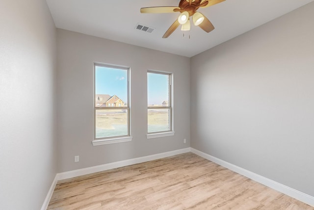 empty room featuring ceiling fan and light hardwood / wood-style floors