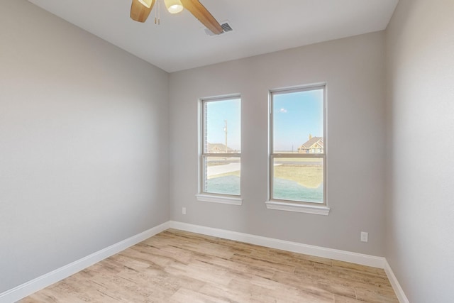 unfurnished room featuring ceiling fan and light hardwood / wood-style flooring