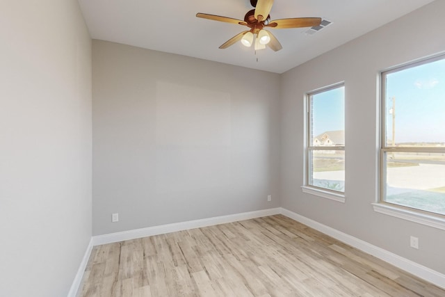 empty room with light hardwood / wood-style floors and ceiling fan