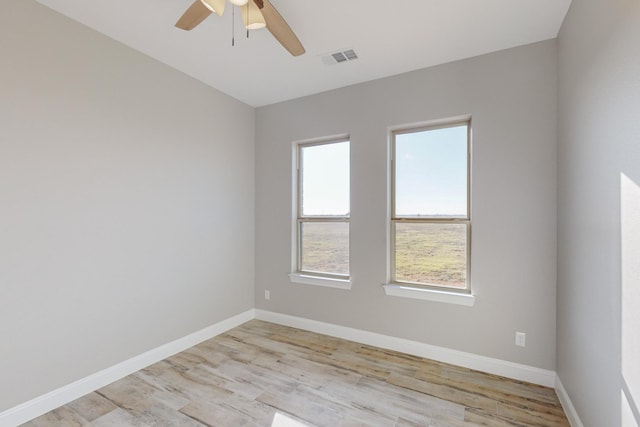 unfurnished room featuring ceiling fan and light hardwood / wood-style flooring