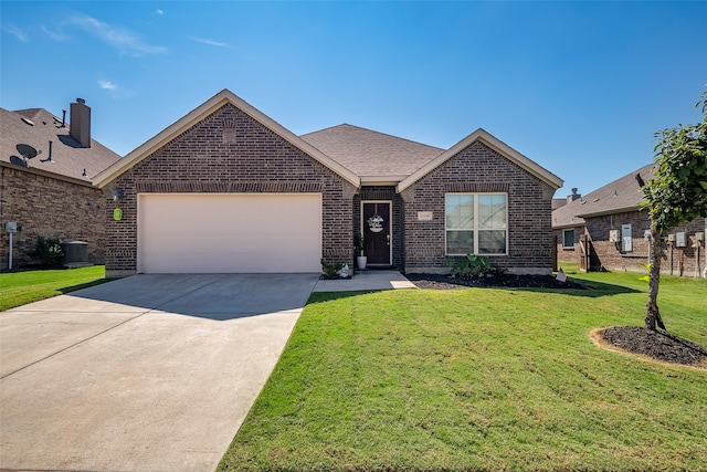 view of front of home featuring a garage and a front lawn