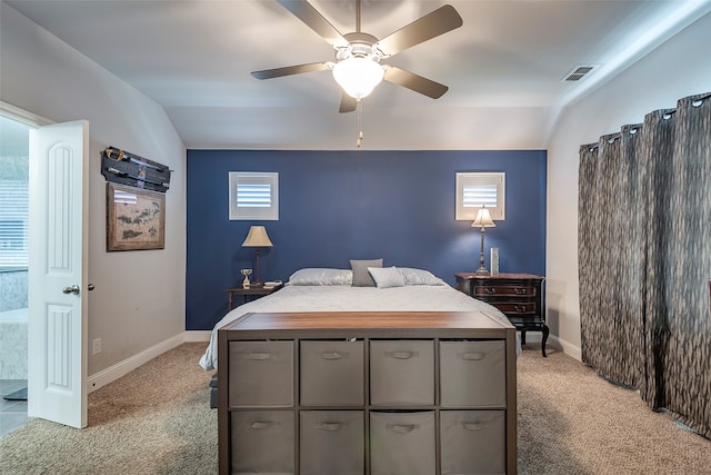 carpeted bedroom with ceiling fan and lofted ceiling