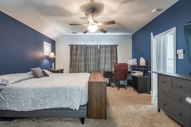 bedroom featuring vaulted ceiling, ceiling fan, and light colored carpet