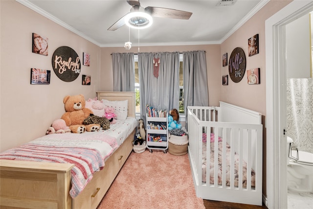 bedroom with ornamental molding, carpet, and ceiling fan