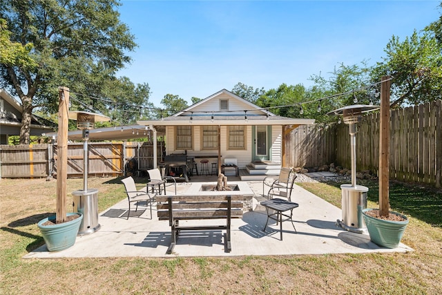 505 S Boyd, Lindale, TX 75771 - back of house with an outdoor fire pit, a fenced backyard, a patio area, and a lawn