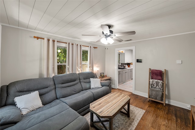 living room with sink, ceiling fan, crown molding, and dark hardwood / wood-style flooring