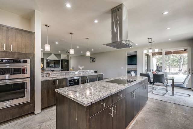 kitchen featuring a center island, hanging light fixtures, black electric cooktop, double oven, and extractor fan