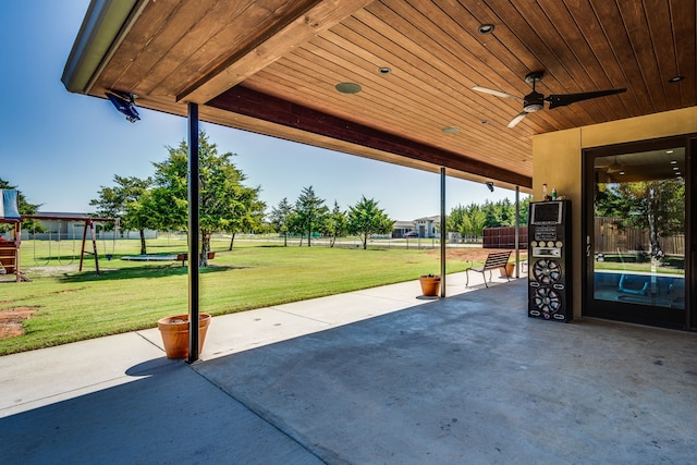 view of patio / terrace featuring ceiling fan and a playground