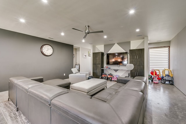 home theater room featuring ceiling fan