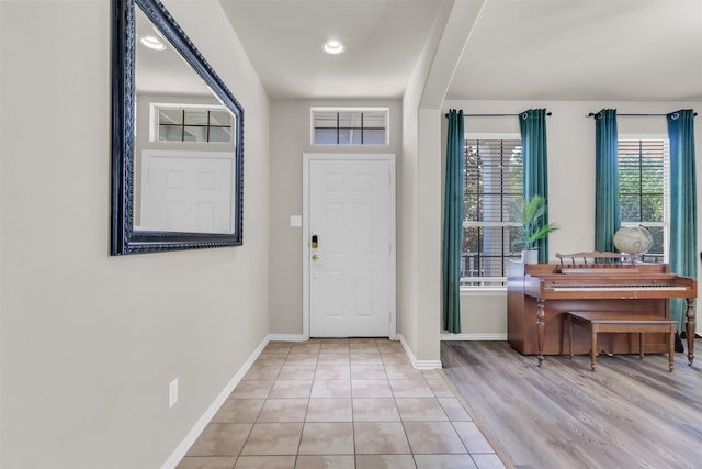 foyer entrance with light wood-type flooring