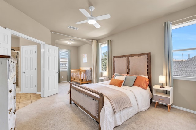 carpeted bedroom with ceiling fan