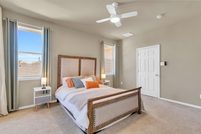 carpeted bedroom with a nursery area