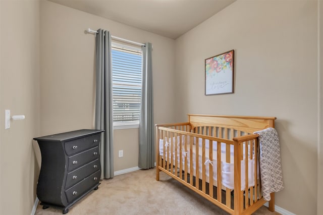 carpeted bedroom with a crib