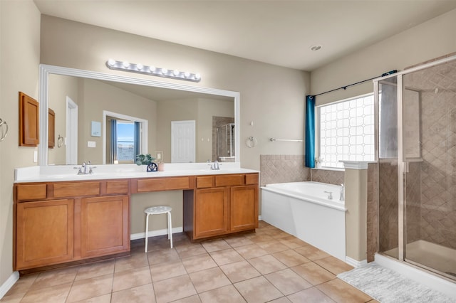 bathroom with tile patterned flooring, vanity, and independent shower and bath