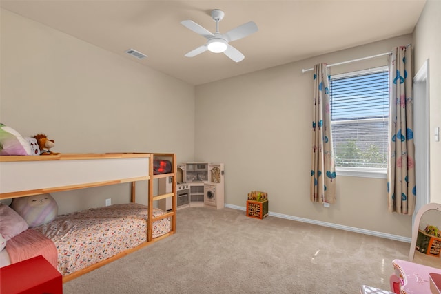 bedroom with ceiling fan and light colored carpet