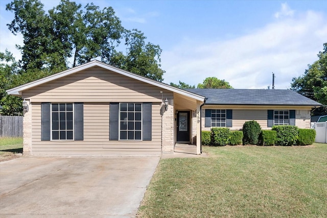 ranch-style home with a front lawn