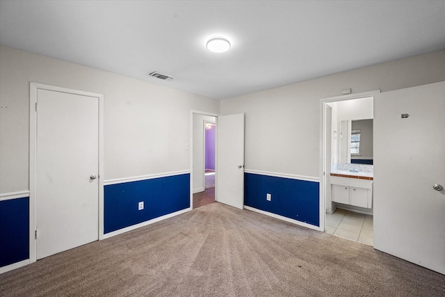 carpeted empty room with ceiling fan, ornamental molding, and a textured ceiling