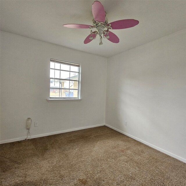 carpeted empty room with ceiling fan, ornamental molding, and a textured ceiling