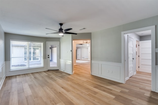 unfurnished room featuring ceiling fan and light hardwood / wood-style flooring