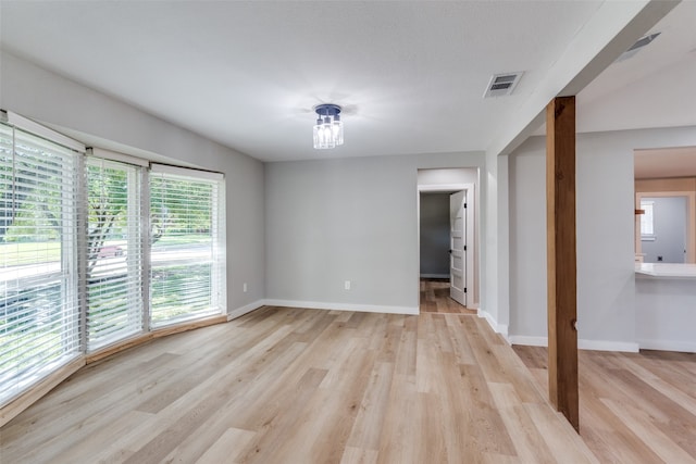 spare room with light hardwood / wood-style floors