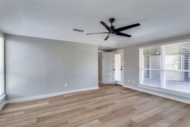 spare room with light hardwood / wood-style flooring and ceiling fan