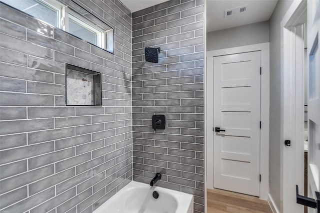 2625 Mollimar Dr, Plano, TX 75075 - full bathroom featuring wood finished floors, visible vents, and bathtub / shower combination