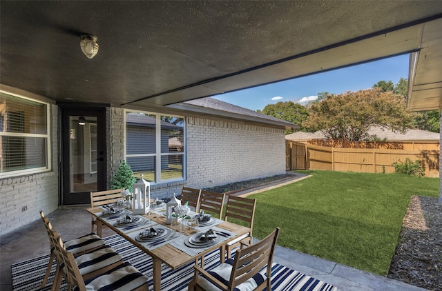 2625 Mollimar Dr, Plano, TX 75075 - view of patio featuring outdoor dining space and a fenced backyard