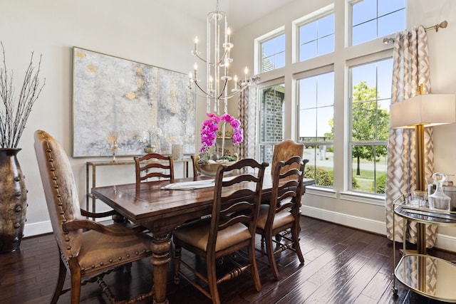 dining room featuring a wealth of natural light, a chandelier, and dark hardwood / wood-style floors