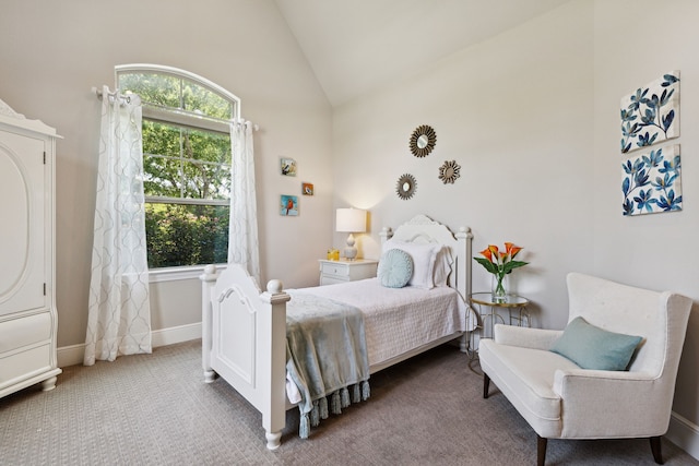 bedroom featuring high vaulted ceiling and carpet floors