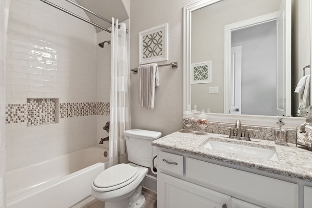 full bathroom with shower / bathtub combination with curtain, vanity, and toilet