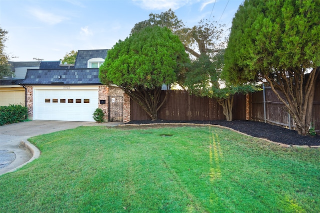 view of yard featuring a garage