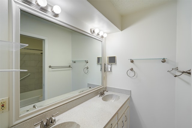 bathroom featuring double vanity and a sink