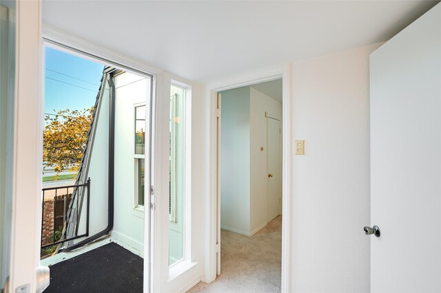 unfurnished room with ceiling fan and light colored carpet