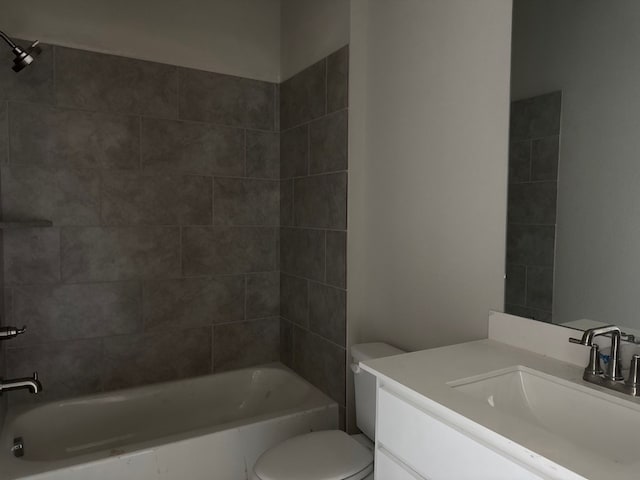 full bathroom with tiled shower / bath combo, toilet, and vanity