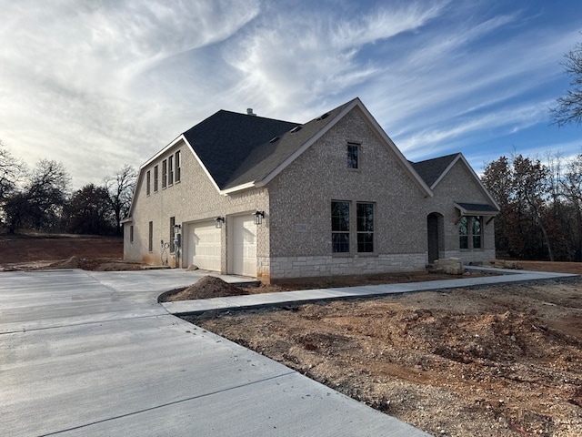 view of front of property with a garage