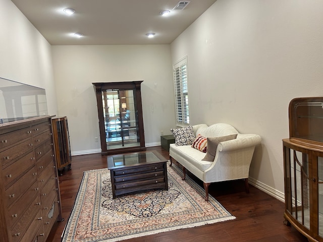 living area with dark hardwood / wood-style floors