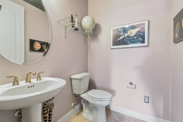 bathroom featuring tile patterned floors, sink, and toilet